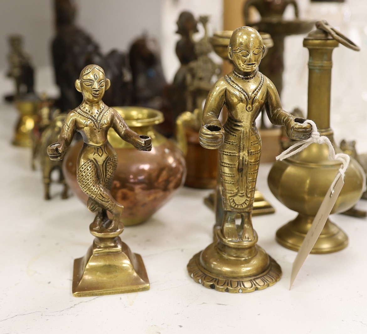 A quantity of Indian carvings and cast brass figures, tallest 20cm